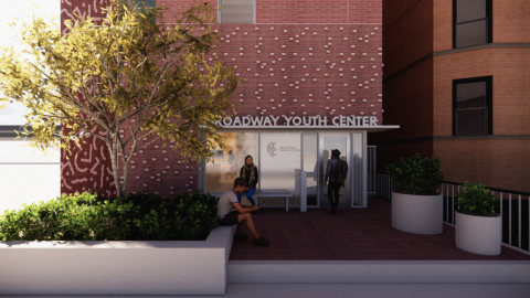 A rendering of a five-story health and community clinic with a brick facade. 