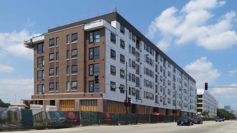 Two six-story apartment buildings under construction. 